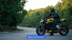Motorcyclist riding a yellow motorcycle on a scenic road