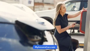 Woman charging her electric car at a charging station