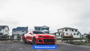 Red Chevrolet Camaro parked on a suburban street