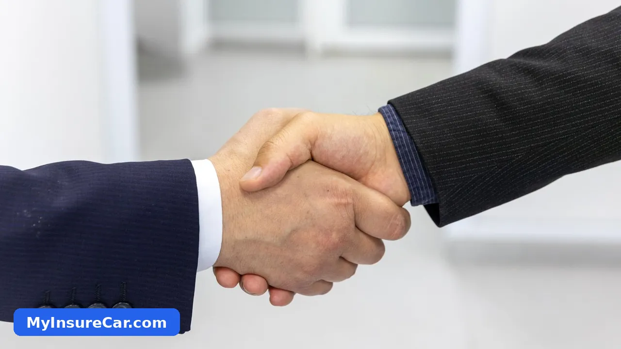 Insurance agent shaking hands with a client