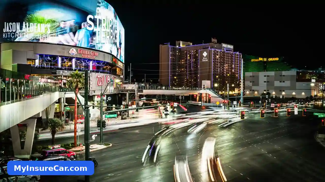 The Las Vegas Strip at night with traffic light trails and glowing casino buildings